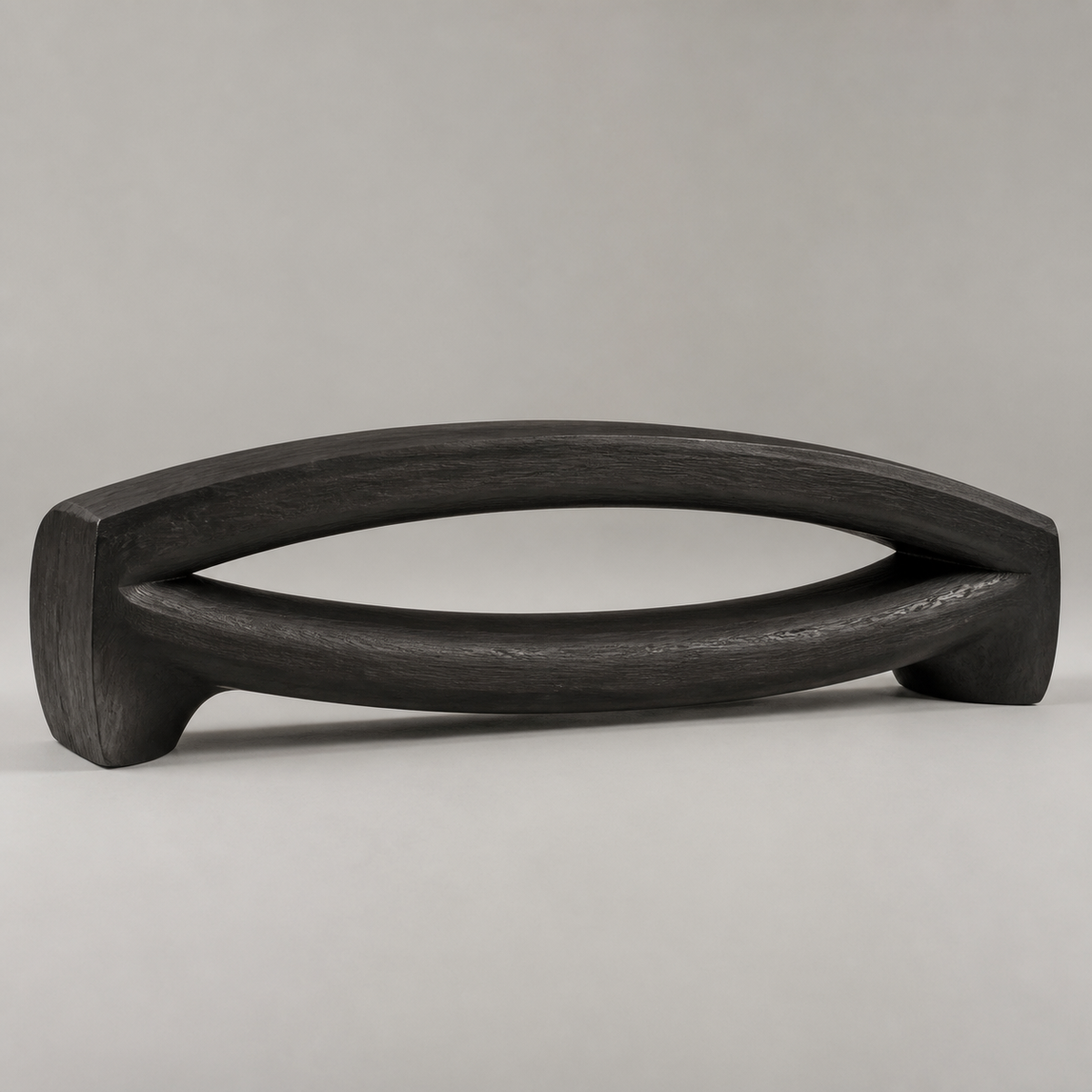 Bowed Traverse, teak wood floor sculpture — three-quarter view