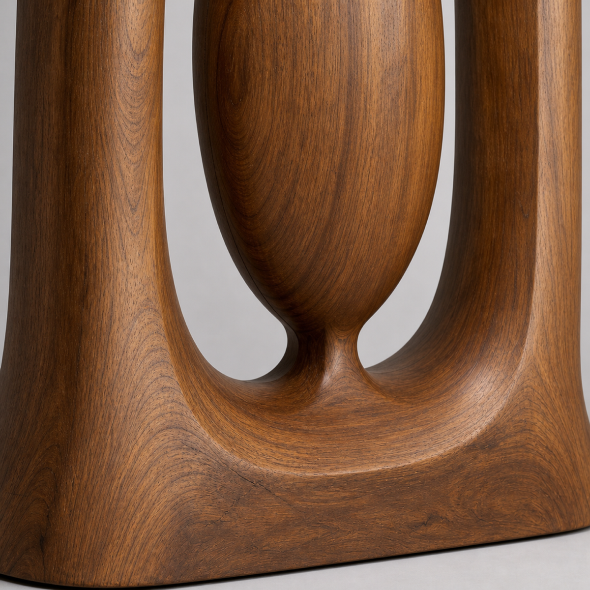 Suspended Core, teak wood floor sculpture — wood grain and carved detail