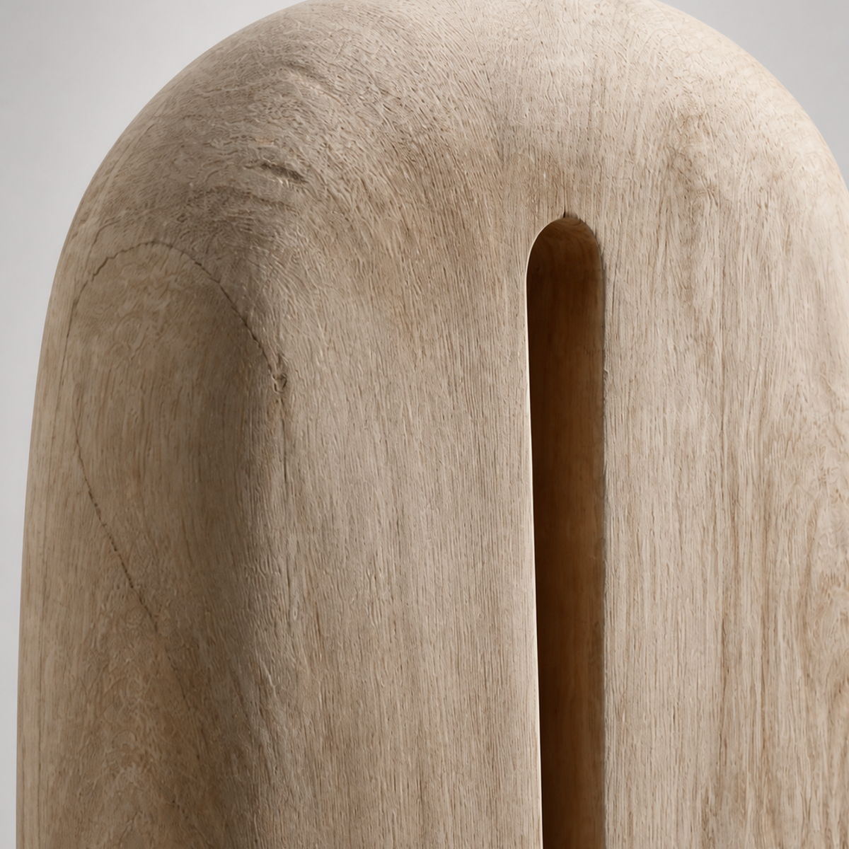 Crowned Slot, teak wood floor sculpture — wood grain and carved detail