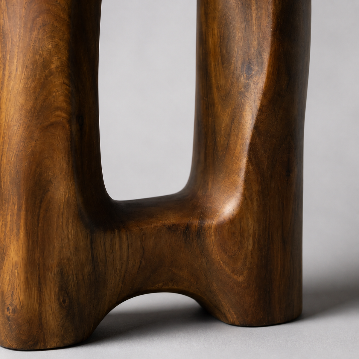 Twin Datum, teak wood floor sculpture — wood grain and carved detail