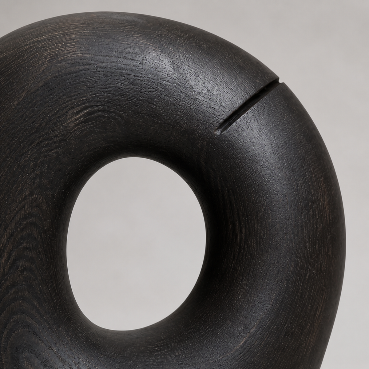Rift Halo, teak wood floor sculpture — wood grain and carved detail