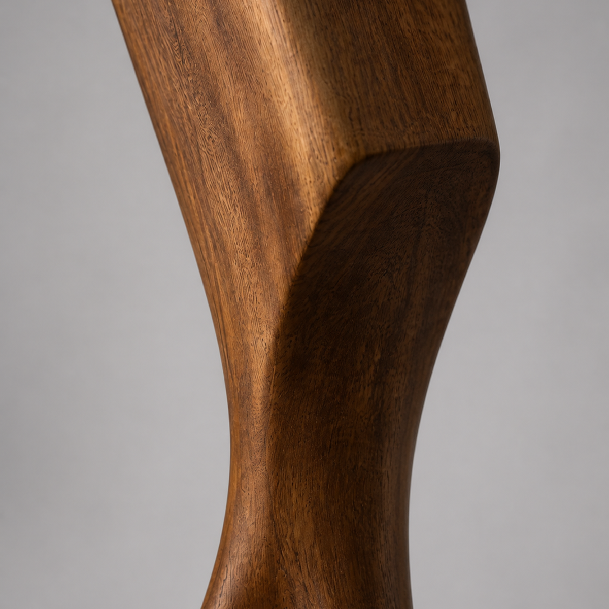 Splayed Axis, teak wood floor sculpture — wood grain and carved detail
