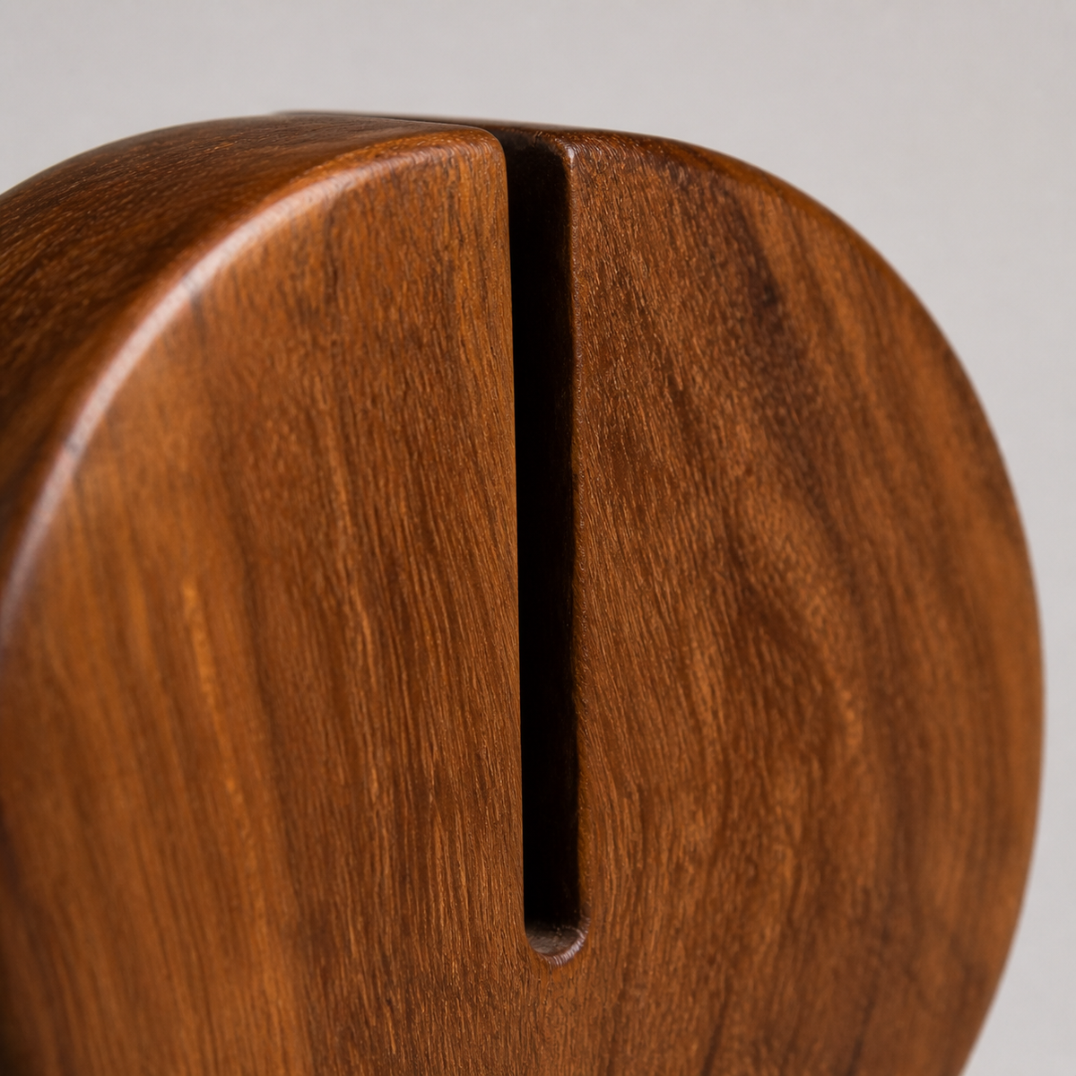 Split Disc Study, teak wood tabletop sculpture — wood grain and carved detail