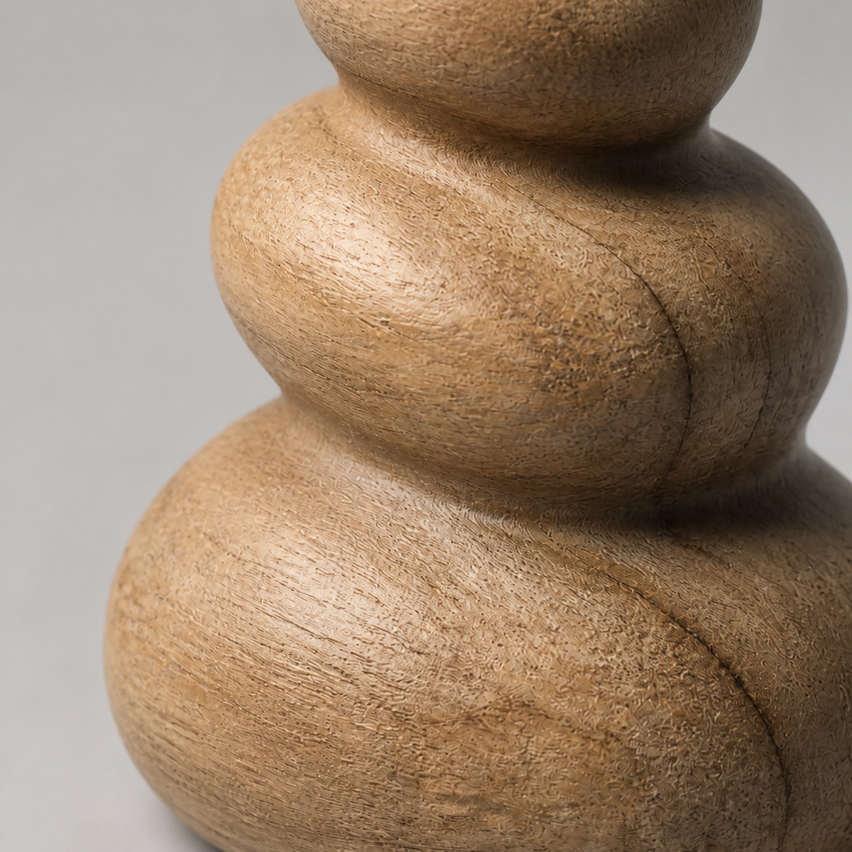 Palm Cairn, teak wood tabletop sculpture — wood grain and carved detail