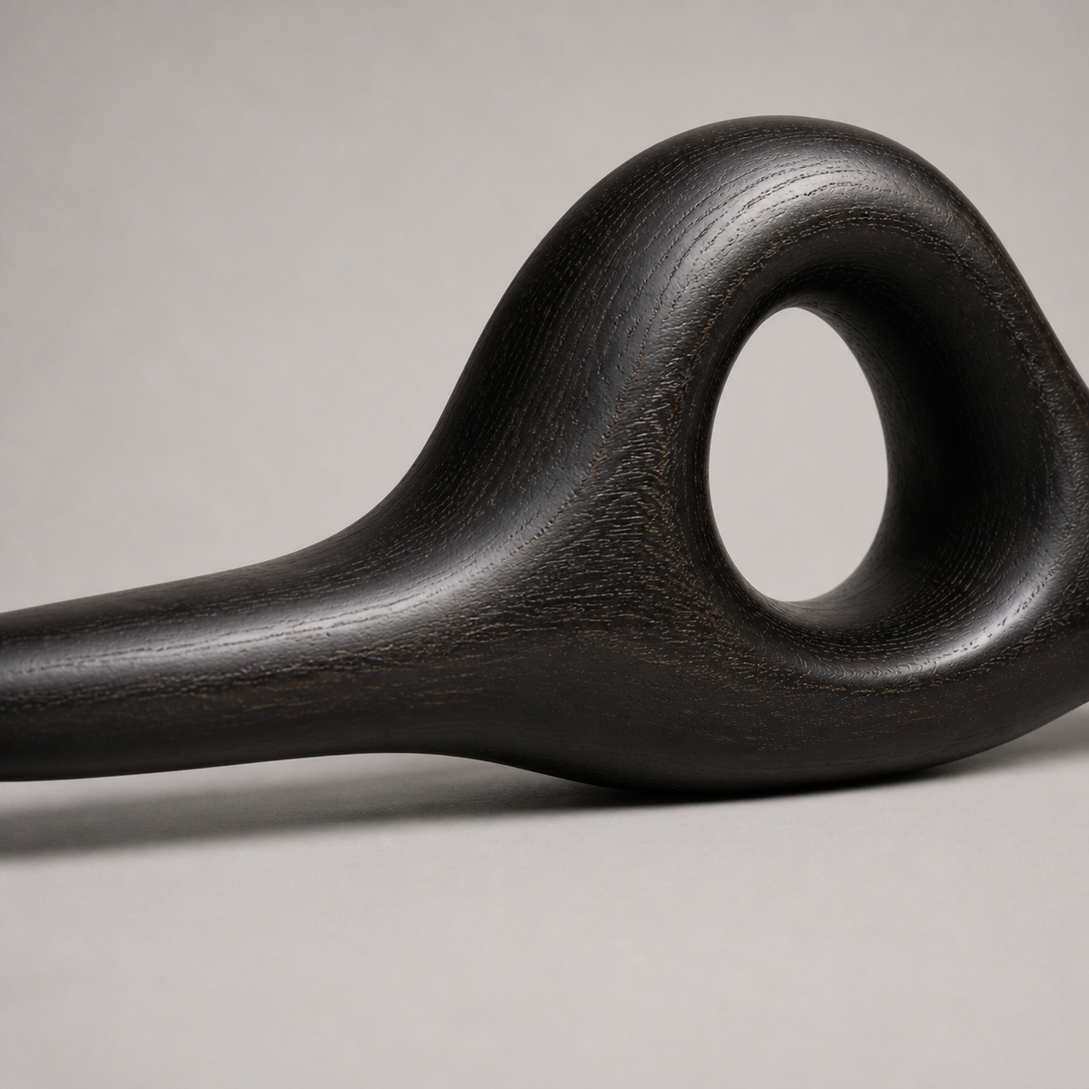 Knotted Lintel, teak wood console sculpture — wood grain and carved detail