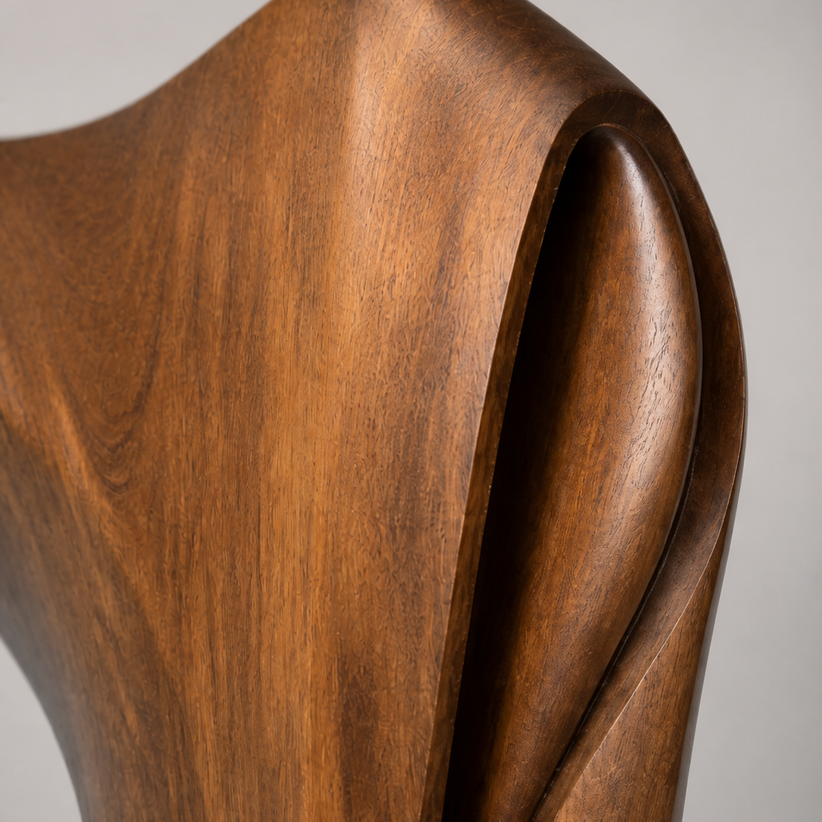 Compression Wing, teak wood floor sculpture — wood grain and carved detail