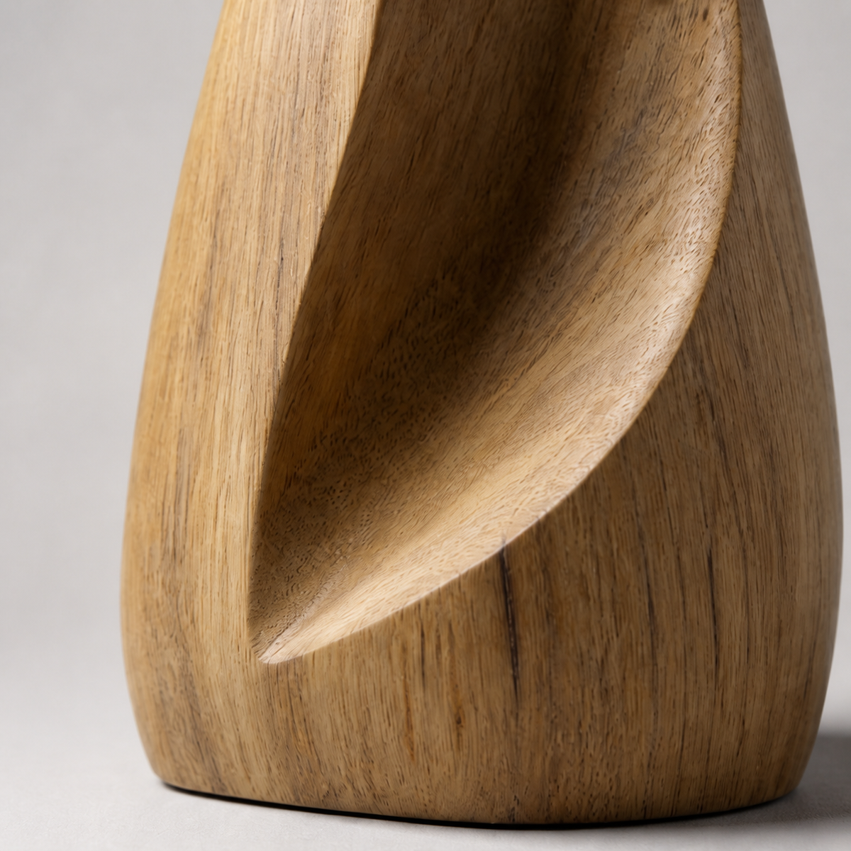 Folded Spire, teak wood floor sculpture — wood grain and carved detail