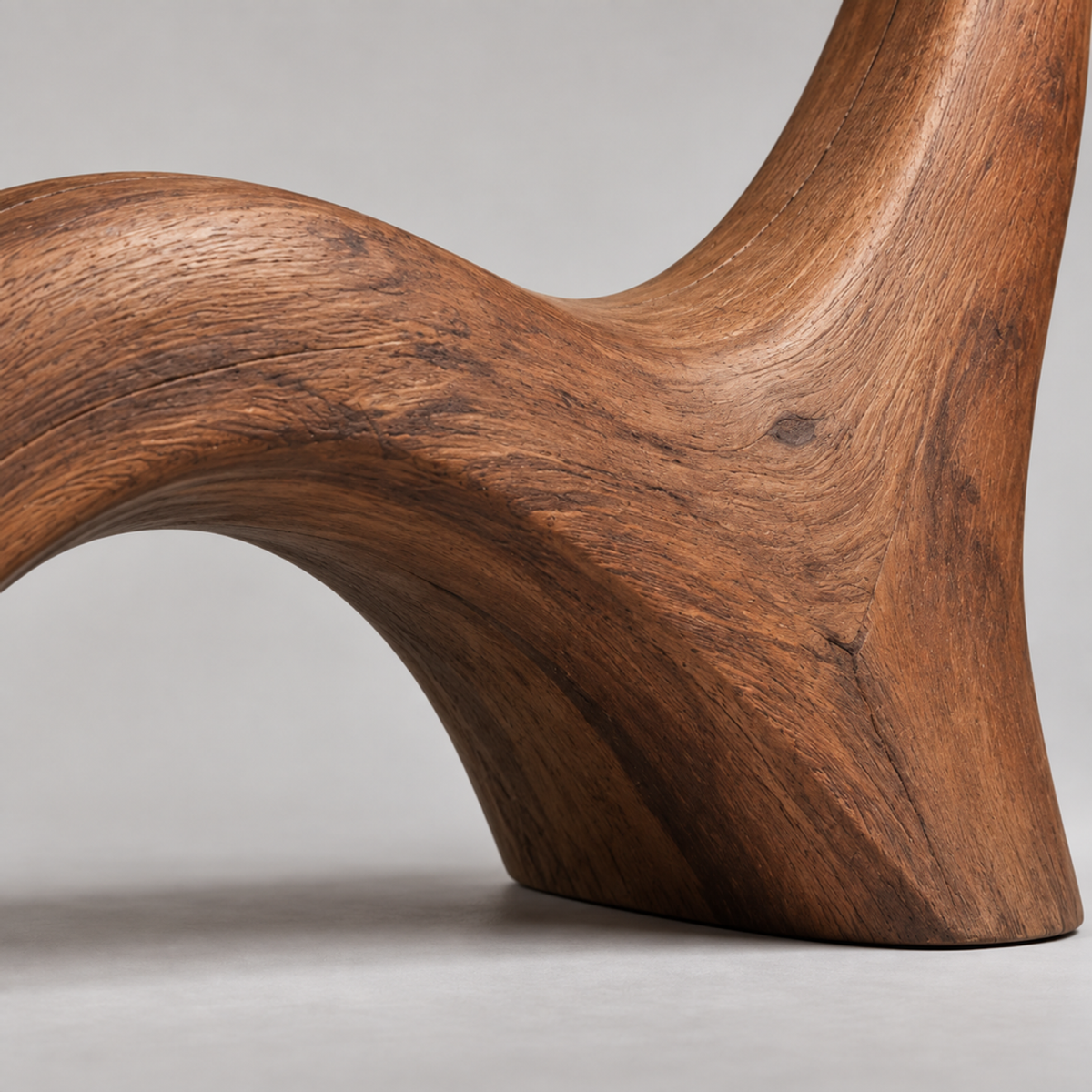 Wave Buttress, teak wood floor sculpture — wood grain and carved detail