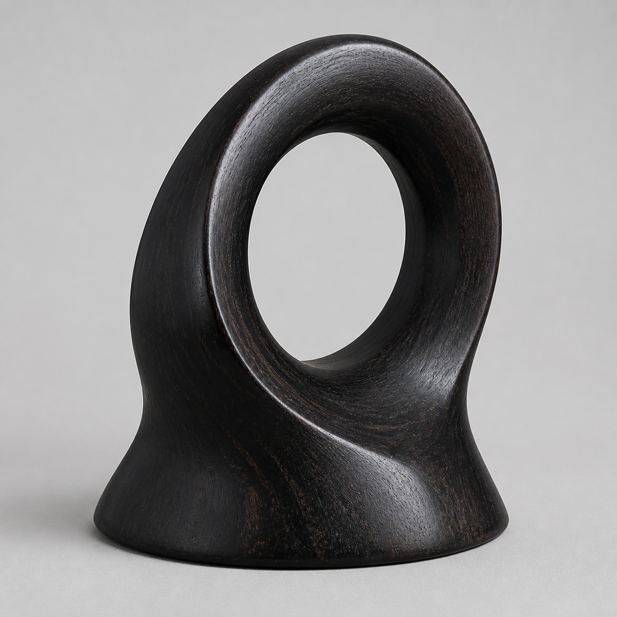 Rooted Loop, teak wood tabletop sculpture — three-quarter view