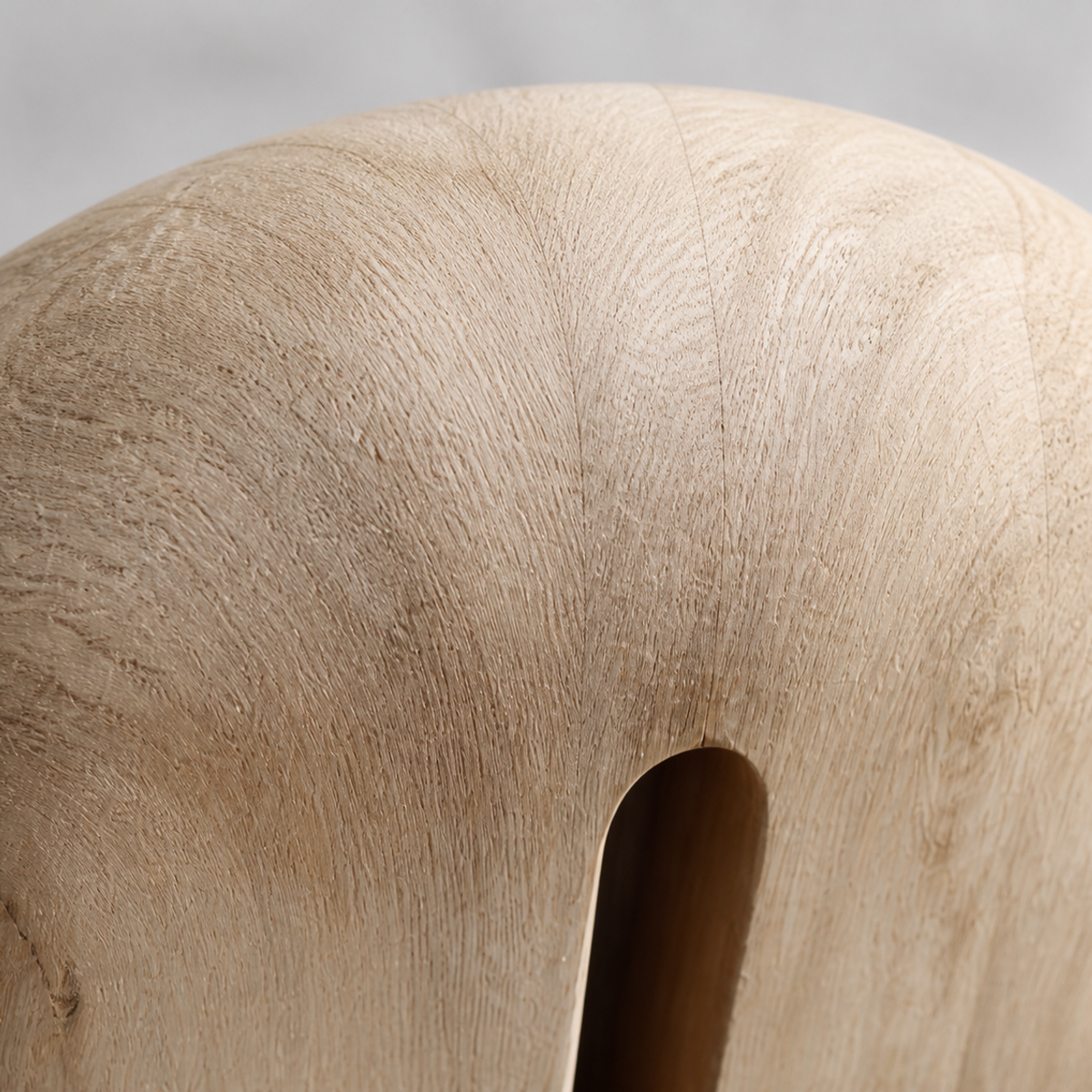 Crowned Slot, teak wood floor sculpture — wood grain and carved detail