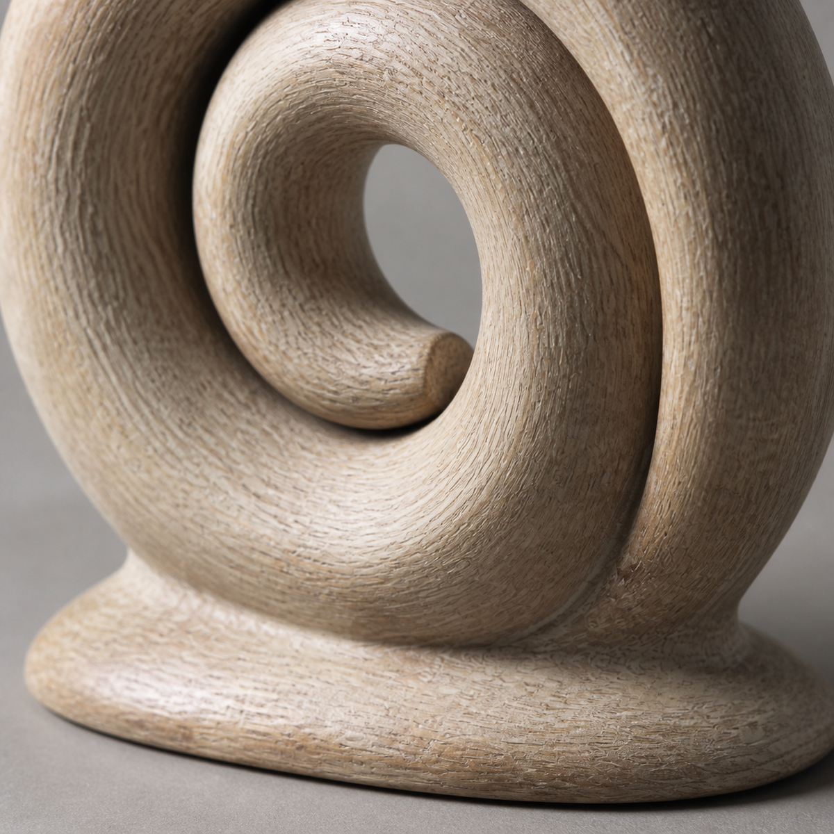 Quiet Coil, abstract teak wood sculpture — wood grain and carved detail
