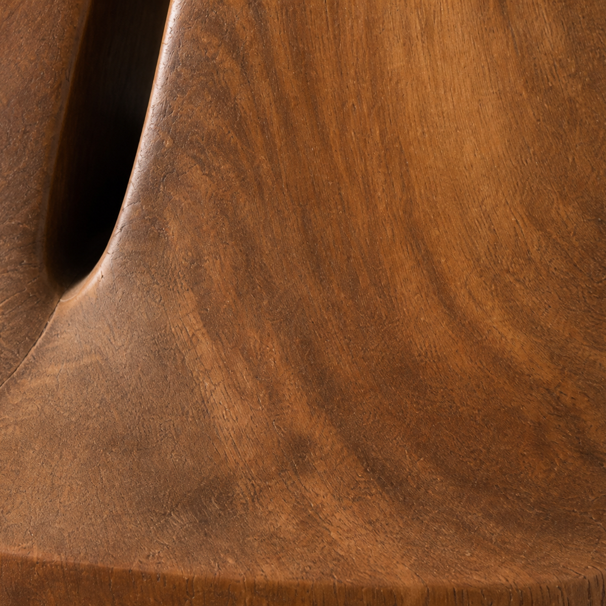 Inward Lean, teak wood floor sculpture — wood grain and carved detail