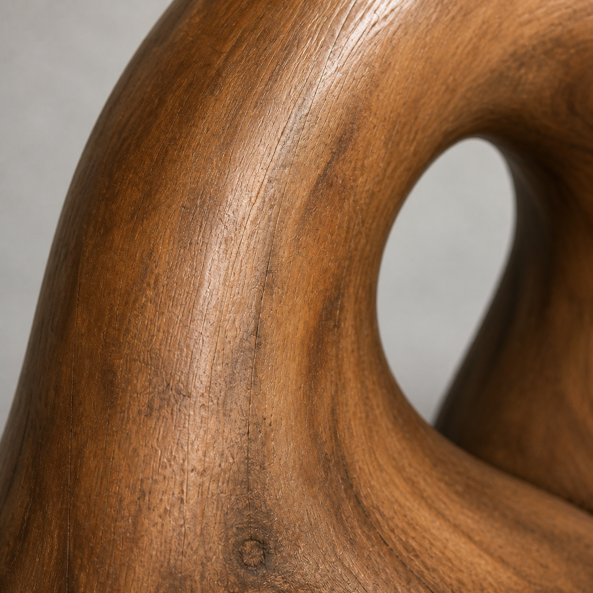 Rooted Arc, abstract teak wood sculpture — wood grain and carved detail