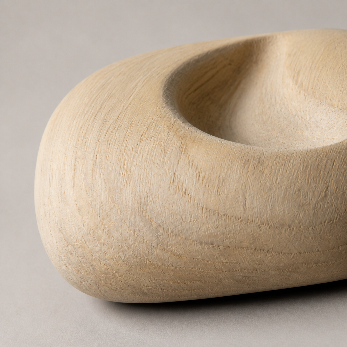 Lunar Inset, teak wood tabletop sculpture — wood grain and carved detail