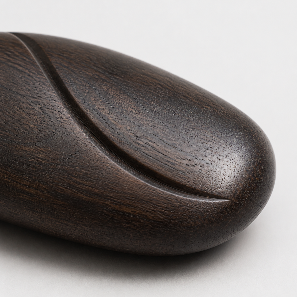 River Stone Study, teak wood tabletop sculpture — wood grain and carved detail