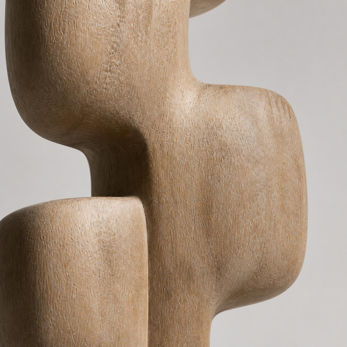 Cairn Spine, teak wood floor sculpture — wood grain and carved detail
