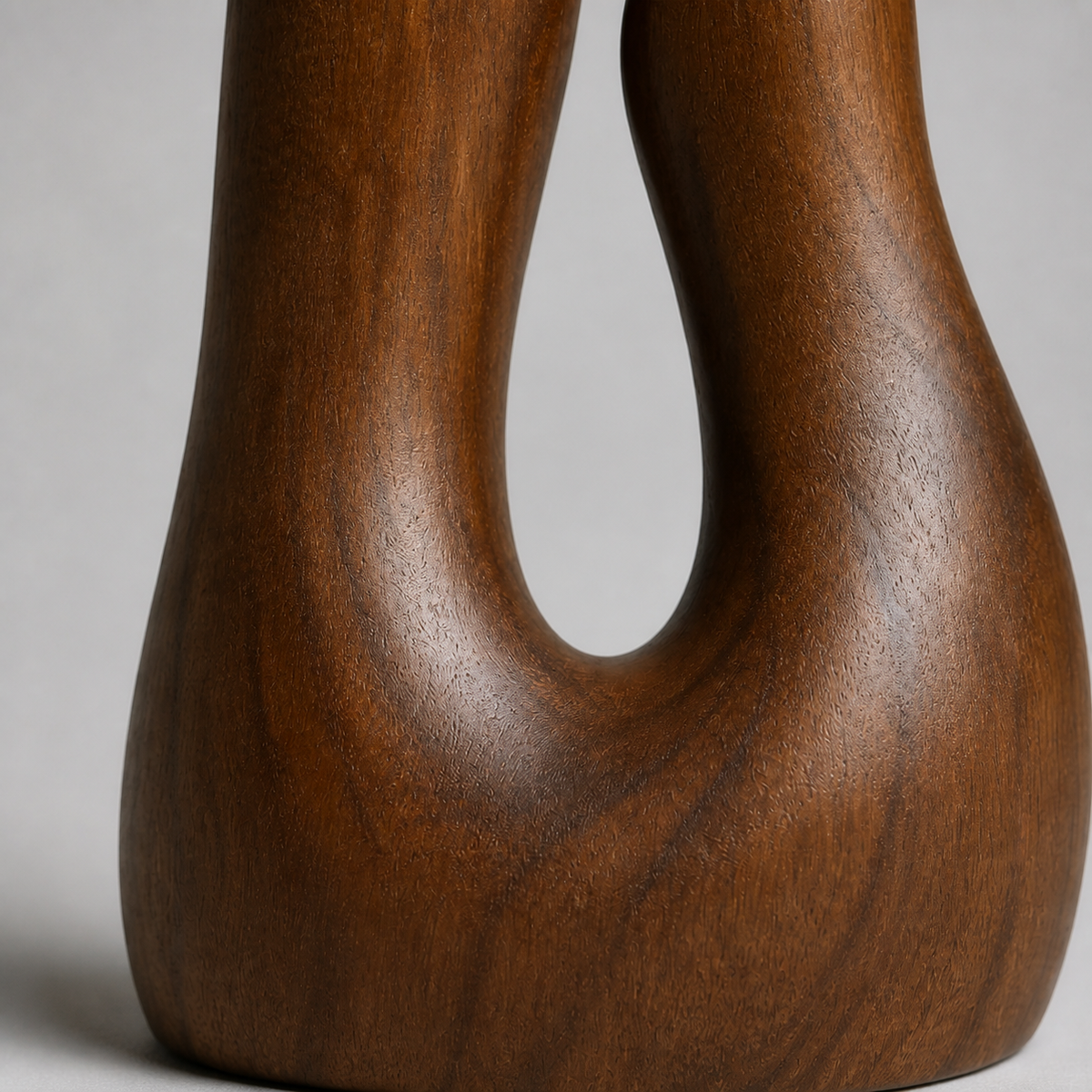Paired Ascent, teak wood floor sculpture — wood grain and carved detail