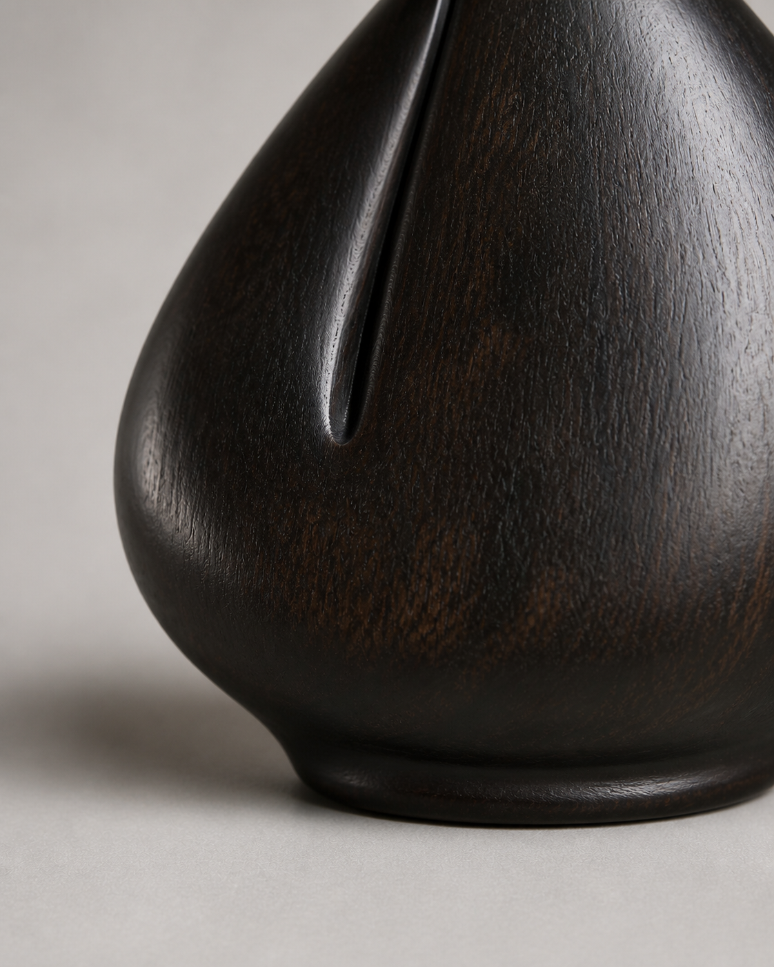 Tension Kernel, teak wood tabletop sculpture — wood grain and carved detail