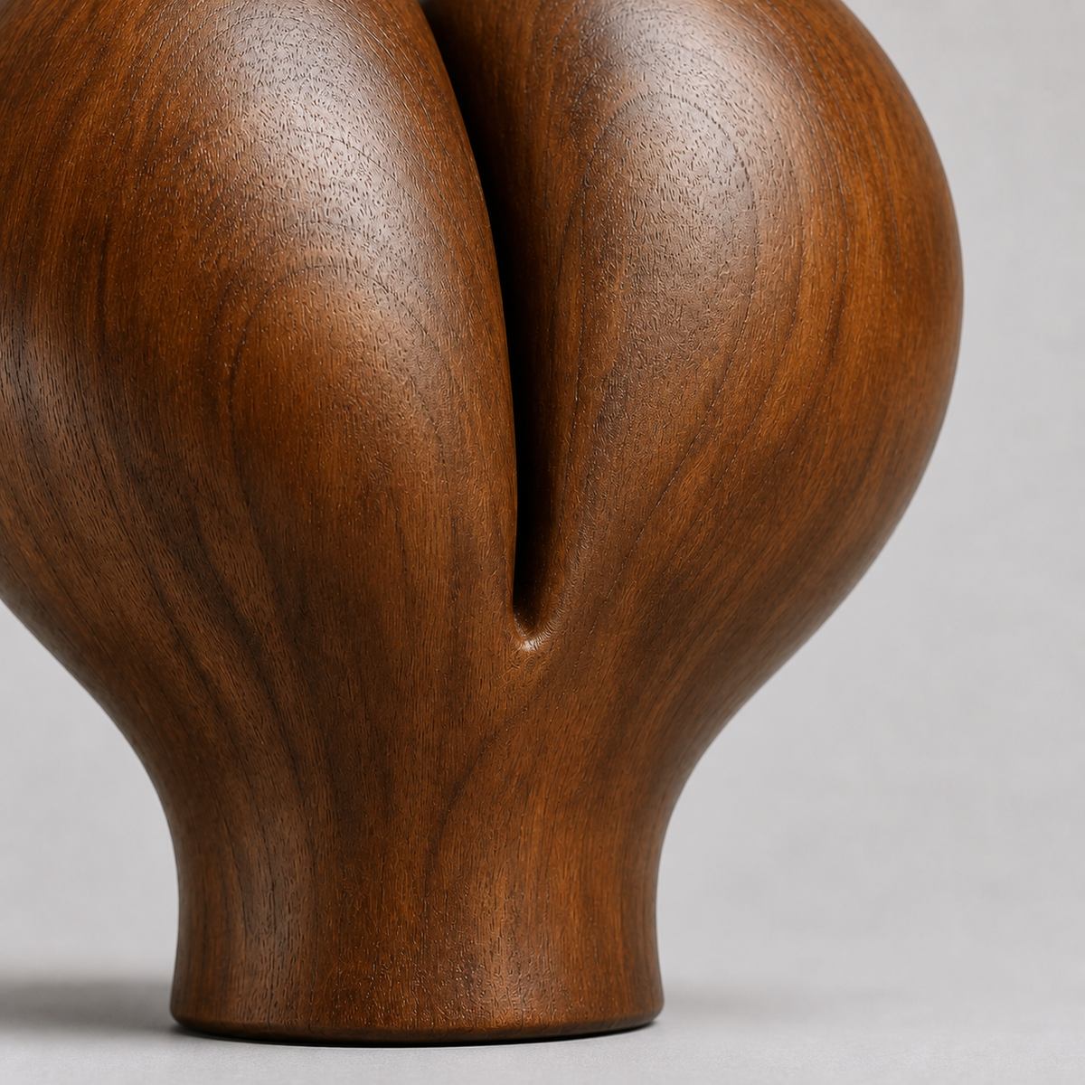 Split Bloom, abstract teak wood sculpture — wood grain and carved detail
