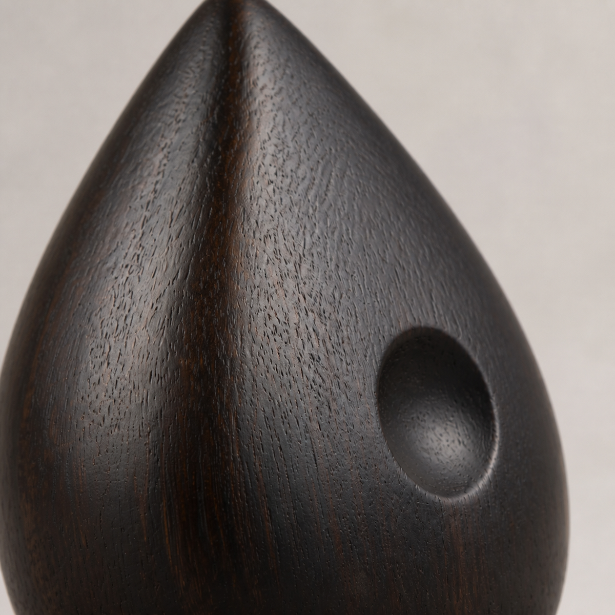 Quiet Seed, teak wood tabletop sculpture — wood grain and carved detail