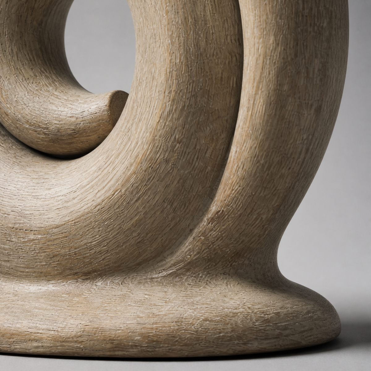 Quiet Coil, abstract teak wood sculpture — wood grain and carved detail