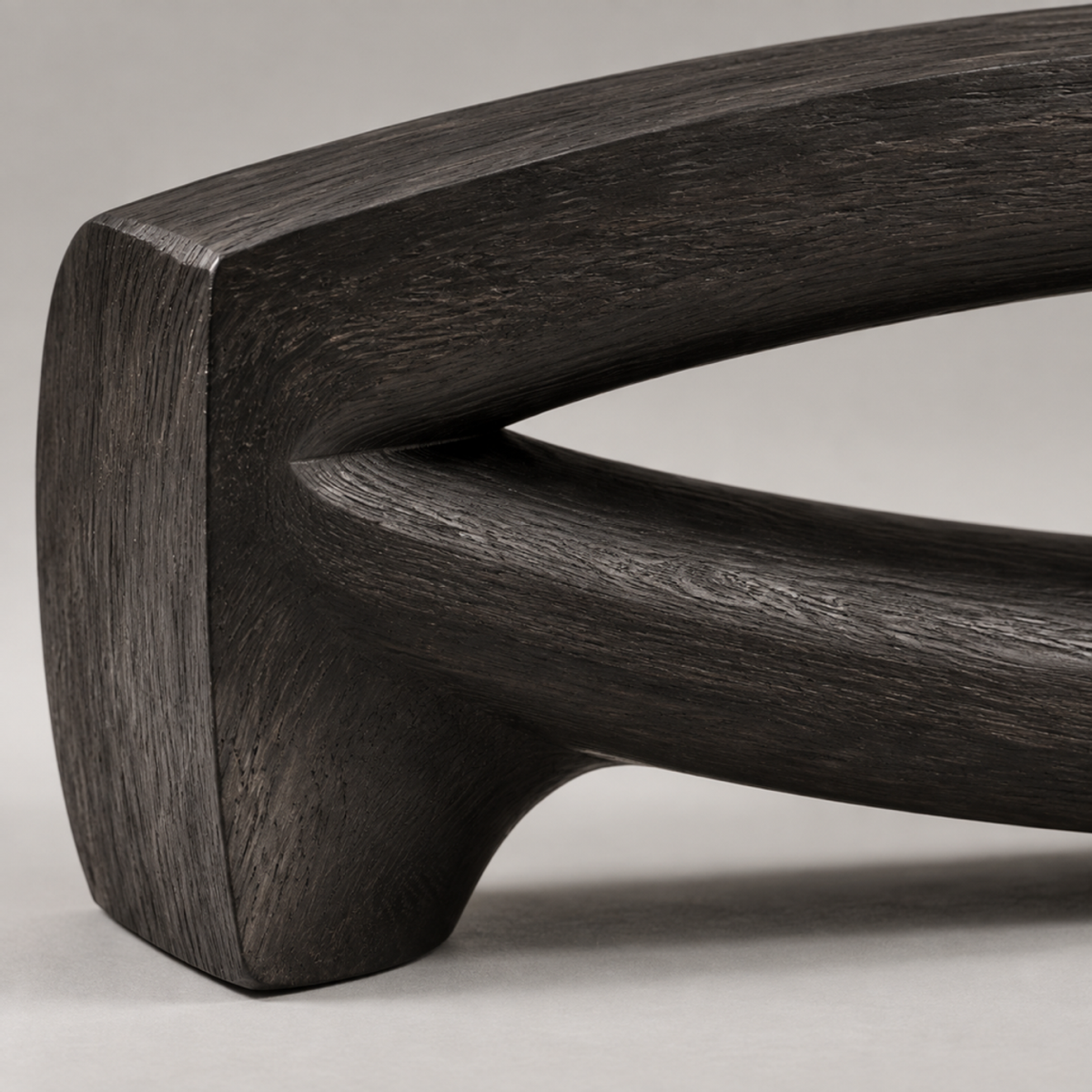Bowed Traverse, teak wood floor sculpture — wood grain and carved detail