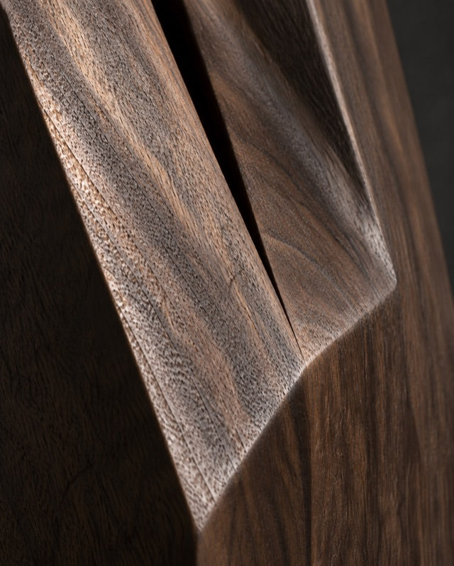 Illustrative close-up of the grain and carved planes of teak.